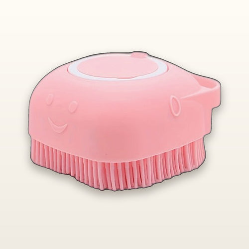 SudsyPet silicone bath brush with shampoo dispenser in pink